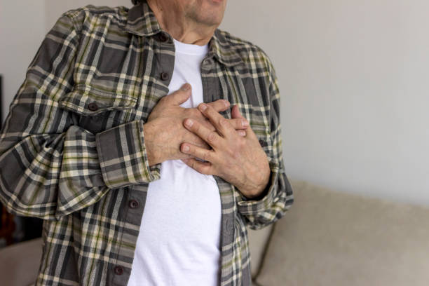 istock Elderly man with hand on chest suffering from chest pain. 1304019766