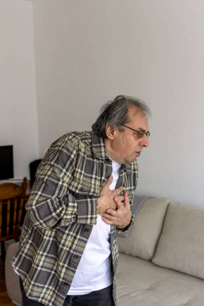 istock Senior man holding his chest in discomfort. 1304019802