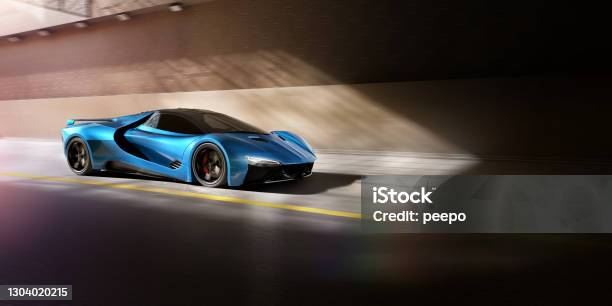 Blue Sports Car About To Travel Through Tunnel At Speed Stock Photo - Download Image Now
