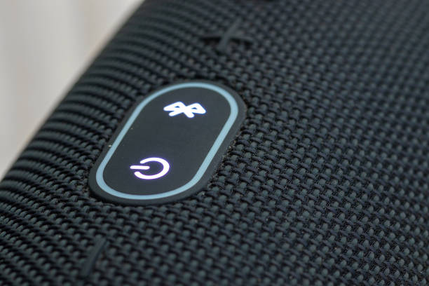 On-off and Bluetooth buttons on the portable boom box close up.