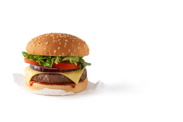 Cheeseburger with beef,tomato, lettuce and onion isolated on white background