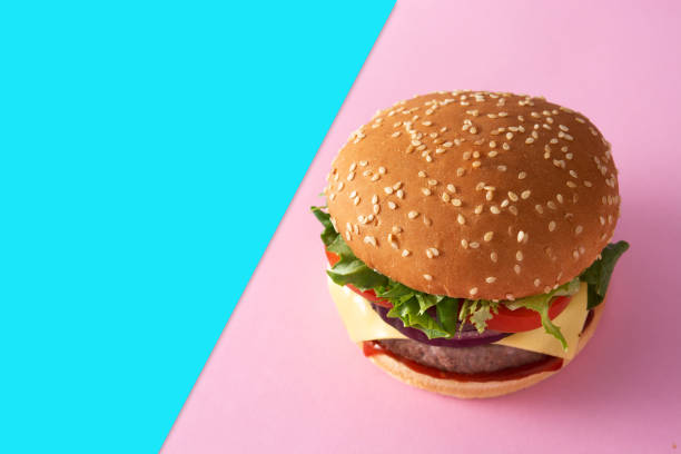 istock Cheeseburger with beef,tomato, lettuce and onion 1304023278
