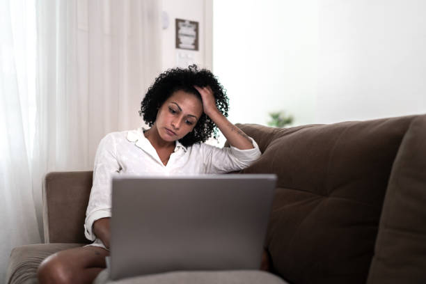 istock Worried woman doing home finances 1304024587