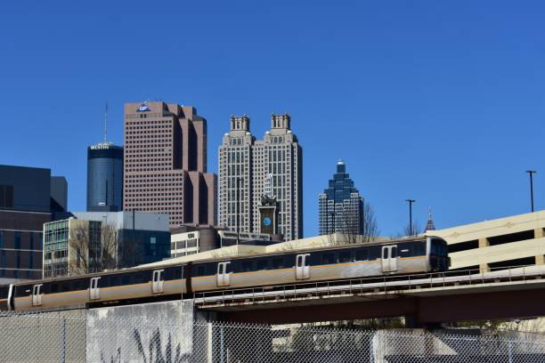 Train moving through Downtown Atlanta on an elevated track