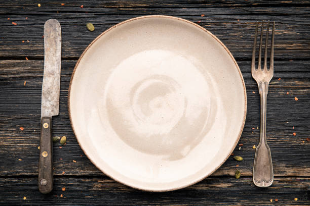 istock Top view of a place setting on dark table. 1304024851