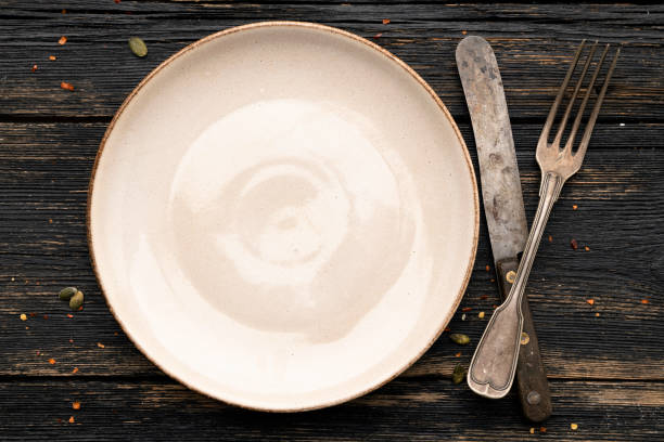 istock Top view of a place setting on dark table. 1304024939