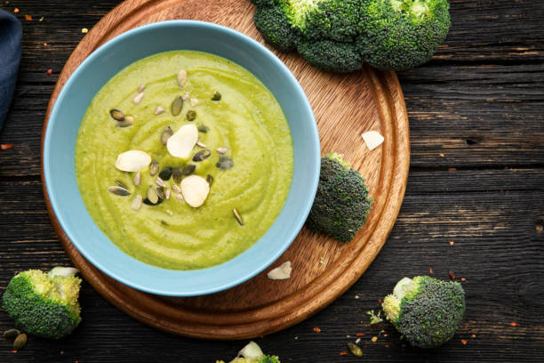 istock Broccoli cream soup on wooden background 1304024963