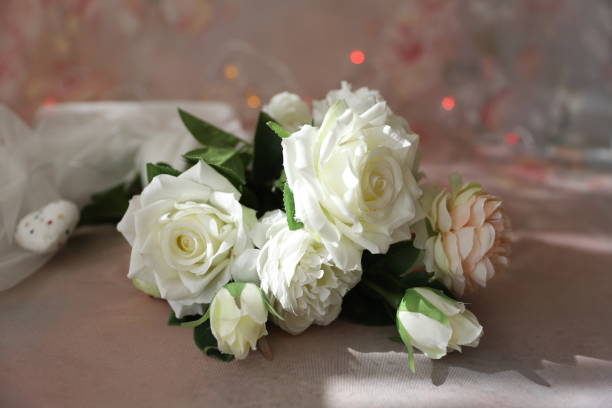 istock White and pink roses with lights at the background 1304026028
