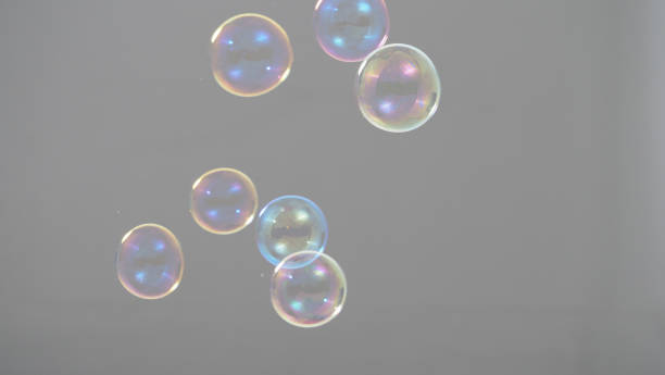 istock Shampoo bubbles floating like flying in the air by wind blow which represent refreshing playful joyful moments and gentle soft comfortable and look wet soapy for hygiene detergent product industry. 1304026388