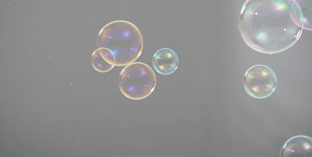 istock Shampoo bubbles floating like flying in the air by wind blow which represent refreshing playful joyful moments and gentle soft comfortable and look wet soapy for hygiene detergent product industry. 1304026435