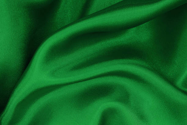 istock Dark green fabric cloth texture for background and design art work, beautiful crumpled pattern of silk or linen. 1304028624