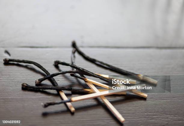 Burnt Matchsticks On Wooden Table Stock Photo - Download Image Now - Burnt, Match - Lighting Equipment, Broken