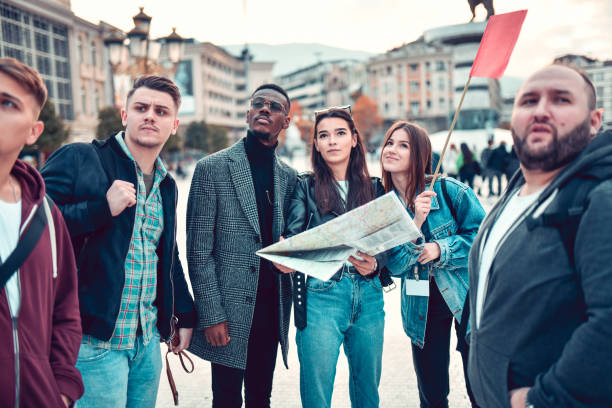 istock Tour Group Marveling At Different Landmarks And Monuments In Big City 1304034008