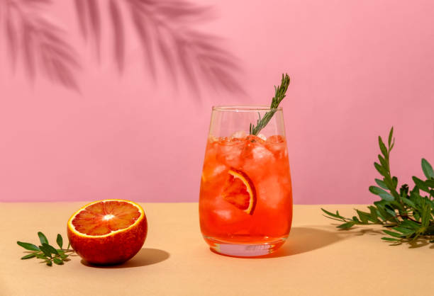 istock Popular summer ice alcoholic cocktail served under the summer sun light. Trendy style with shadows. 1304034061