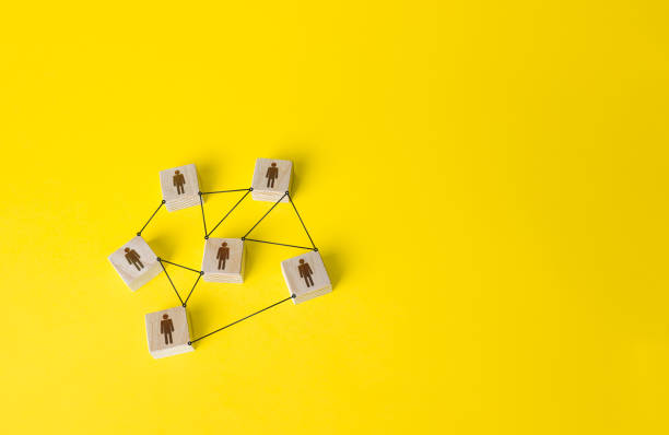 istock Connected people figures form a working team network. Cooperation and division of responsibilities among project participants. Social communication. An efficient small optimal compact business team. 1304034143