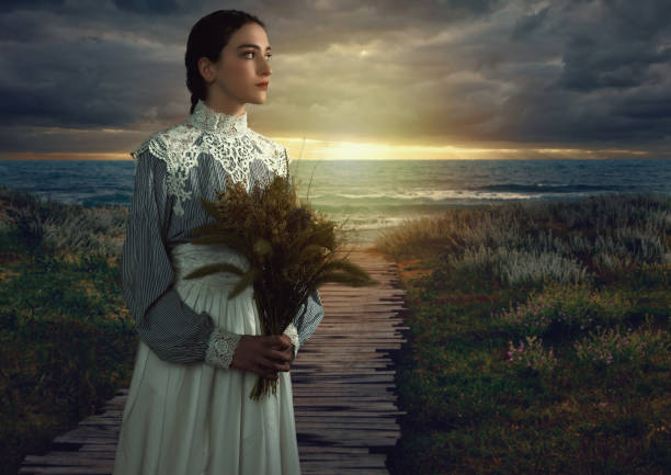istock Young Victorian-Style Girl on Boardwalk at Sunset 1304040060