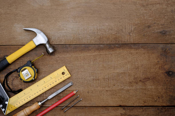 istock Collection of woodworking handtools on a rough workbench wooden 1304040760