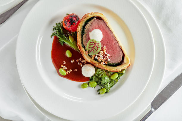 istock Easter meat roll, meatloaf for Easter dinner. Beautifully decorated catering banquet table with different food snacks and appetizers 1304041933