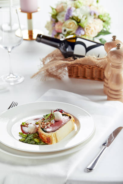 istock Easter meat roll, meatloaf for Easter dinner. Beautifully decorated catering banquet table with different food snacks and appetizers 1304042016
