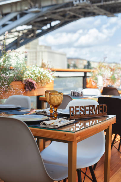 istock Reserved table sign in a restaurant on summer terrace 1304042539