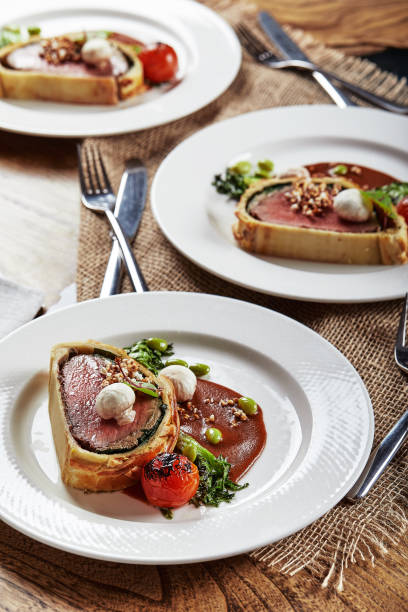 istock Easter meat roll, meatloaf for Easter dinner. Beautifully decorated catering banquet table with different food snacks and appetizers 1304043387