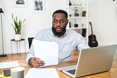 istock African American entrepreneur reading the contract 1304043626