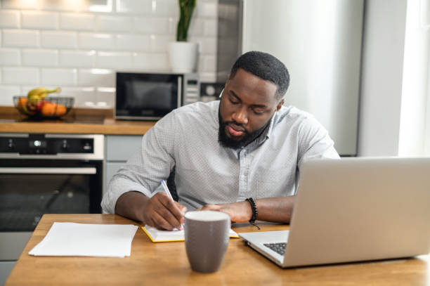 istock African American man studying online from home 1304043634