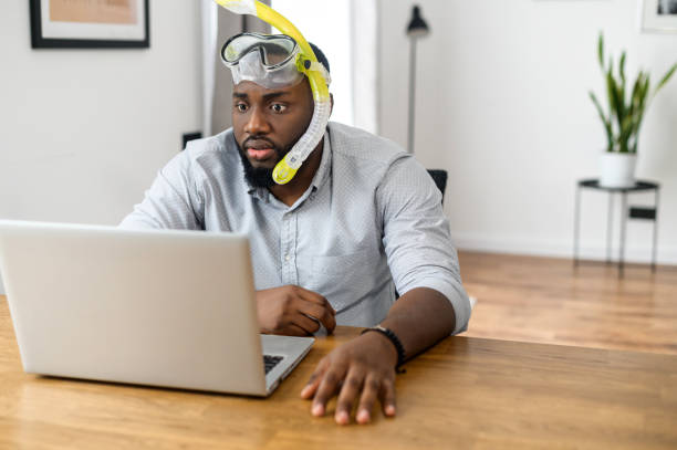 istock Multiracial guy wearing diving mask indoor 1304043655