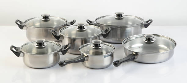 istock Set of stainless pots with lids isolated on white 1304043805