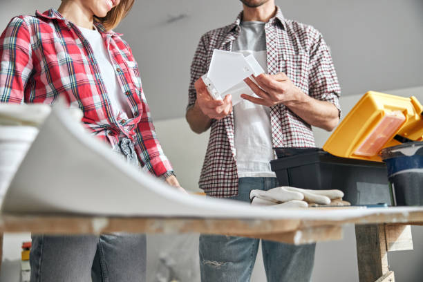 istock Smiling engineer and her colleague working at a building design 1304044054