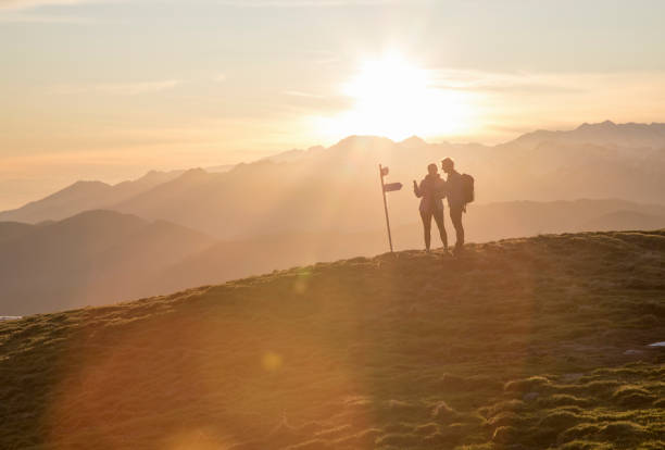 Sun rises over mountains distant