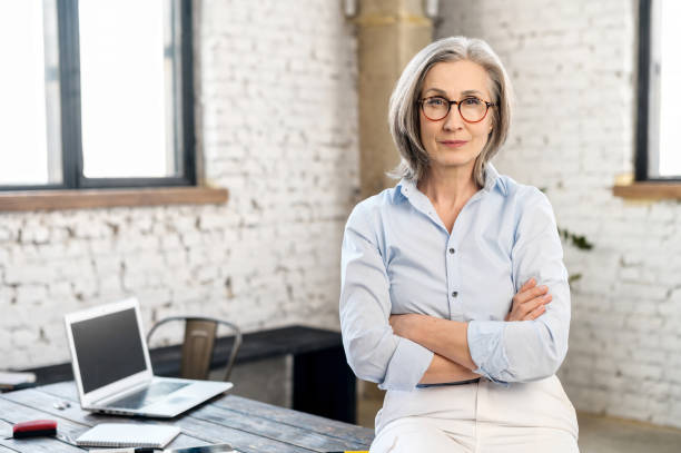 istock Senior woman in smart casual 1304046385