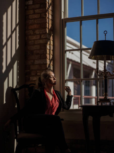 istock Woman Near a Window Thinking 1304047883