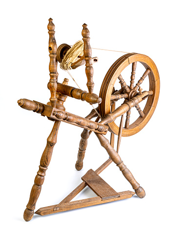 Wooden distaff, spinning wheel isolated on white background