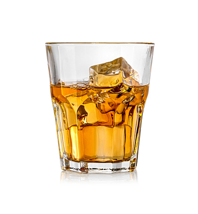 Whiskey glass. Isolated on white with reflection with clipping path