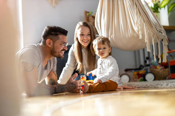 istock Young family having fun together at home 1304049270