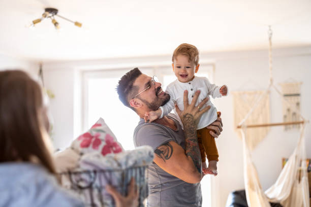 young family having fun together at home - tattoo father family son imagens e fotografias de stock