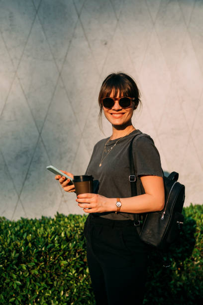 istock Women in Business: a Smiling Young Businesswoman on her Way to Work 1304049548