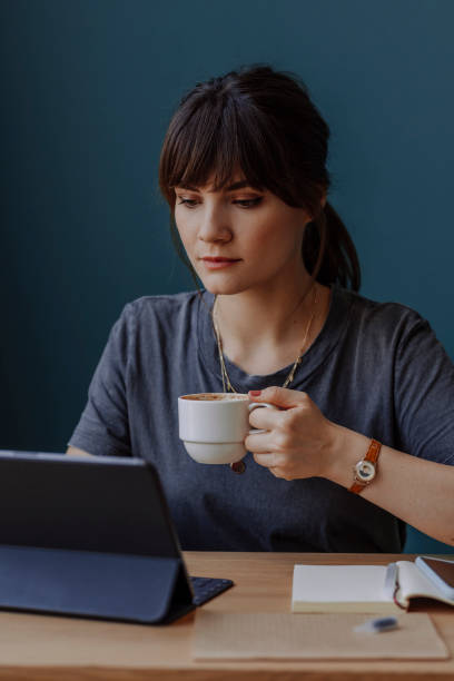 istock Women in Business: a Beautiful Young Businesswoman Using a Digital Tablet at her Office 1304049612