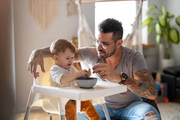 istock Single dad feeding his baby 1304049777