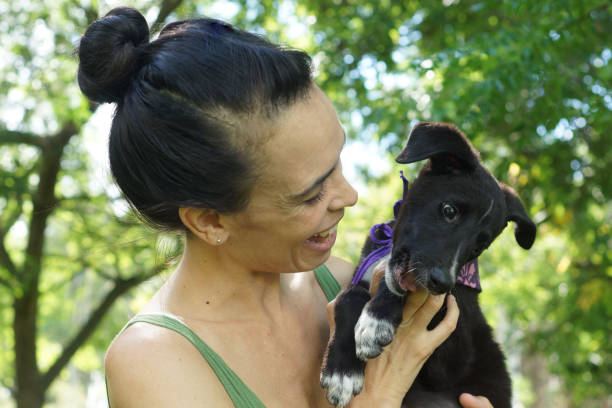 istock woman with her dog 1304052163