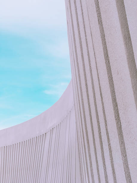 istock Abstract concrete structure receding into the distance. Blue sky is on the background. 1304053777
