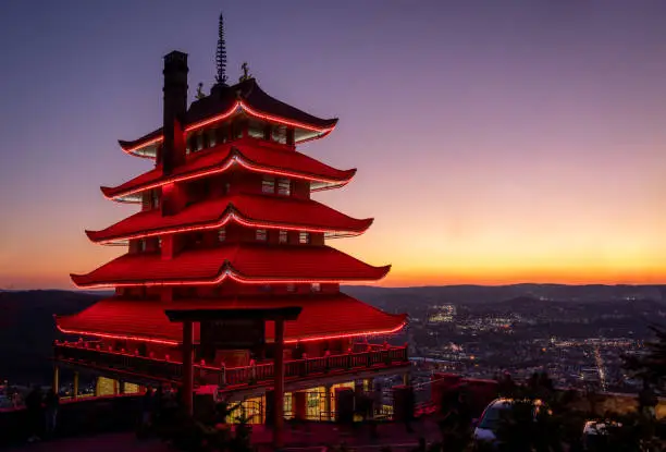 Reading, Pennsylvania - November 28, 2020: The red lights of the Reading Pagoda at night overlooking the city of Reading.