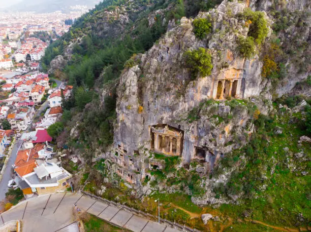 Photo of Antique rock burial chambers in Turkish village of Fethiye