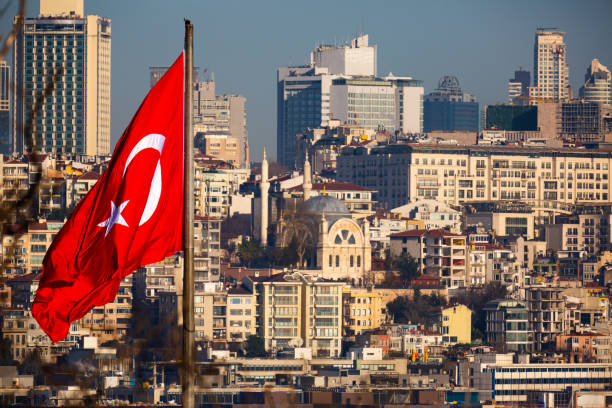 istock National Turkish flag on pole on background with Istanbul cityscape 1304055256