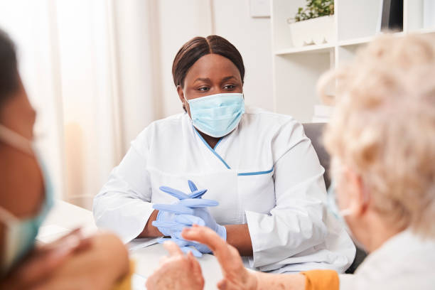 istock Doctor talking with her patient during medical check up 1304056000