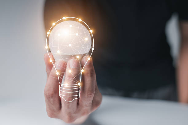 istock man with a light bulb graphics in his hand and the other side holds white stock graphics, concept idea, concept innovation. 1304058454