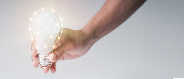 istock man with a light bulb graphics in his hand and the other side holds white stock graphics, concept idea, concept innovation. 1304058515