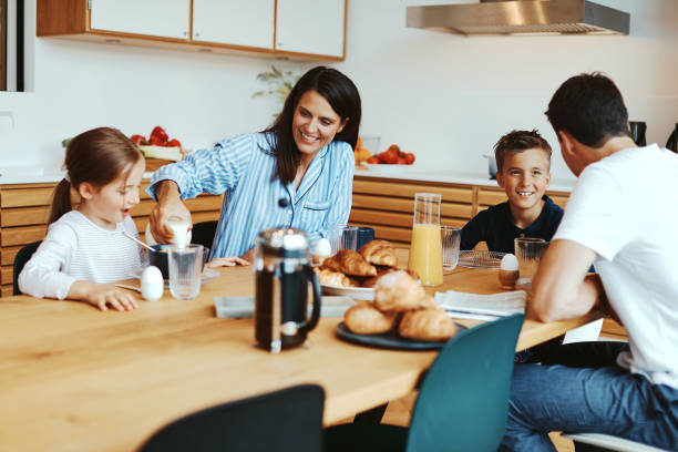 istock Smiling family eating a healthy breakfast 1304061403
