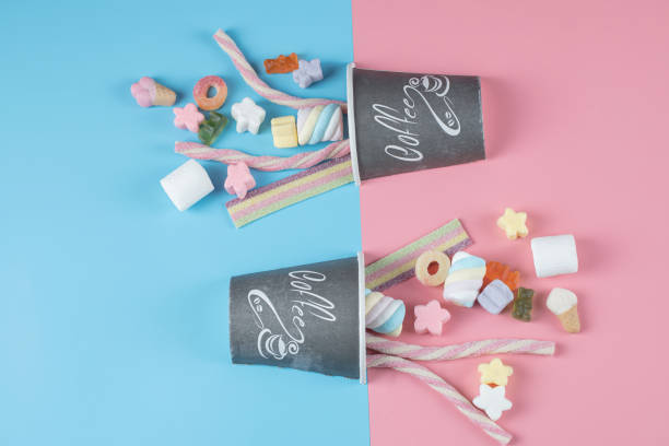 istock Colorful marshmallows out of a black coffee cup 1304062082